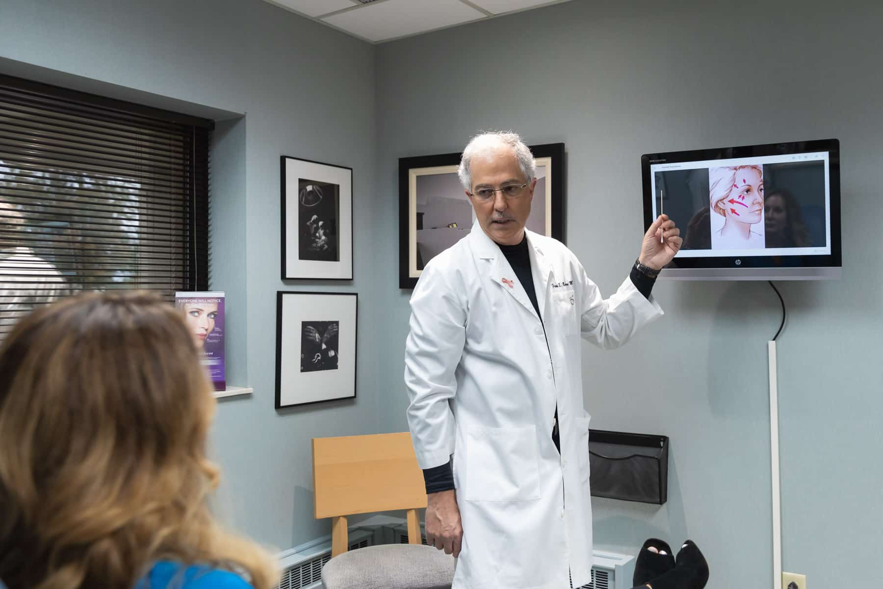 Doctor pointing to a screen